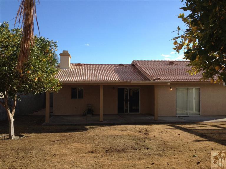 68260 Risueno Road Cathedral City, CA 92234 - Photo 22 of 25 a front view of a house with a yard