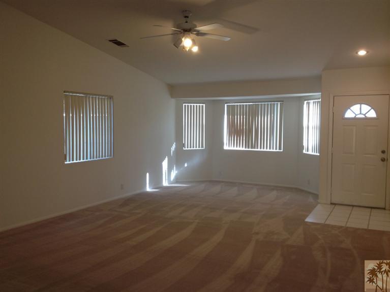 68260 Risueno Road Cathedral City, CA 92234 - Photo 9 of 25 a view of an empty room with window and fireplace