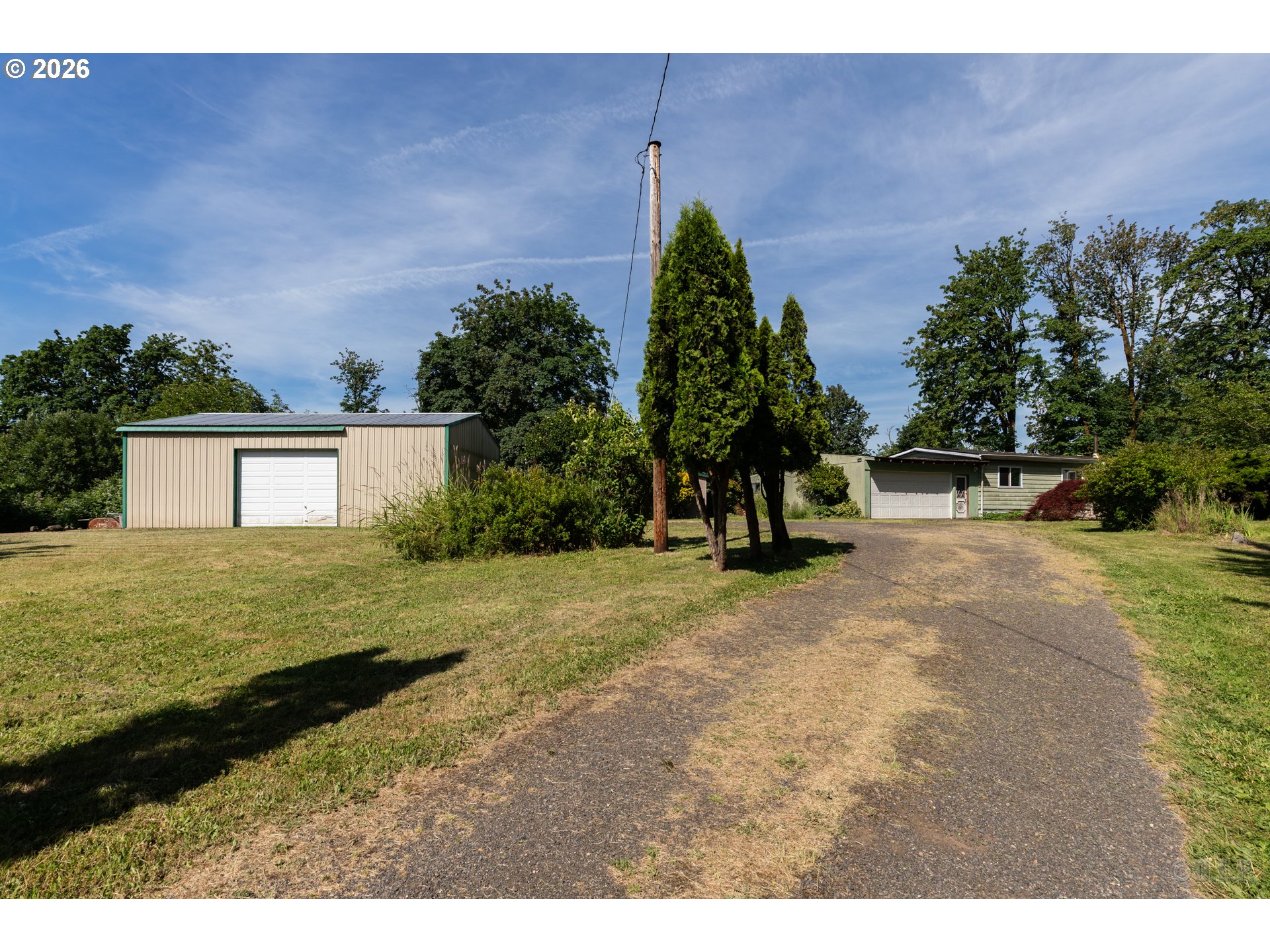 66971 Maplecrest Road Deer Island, OR 97054 - Photo 5 of 24 a backyard of a house with lots of green space