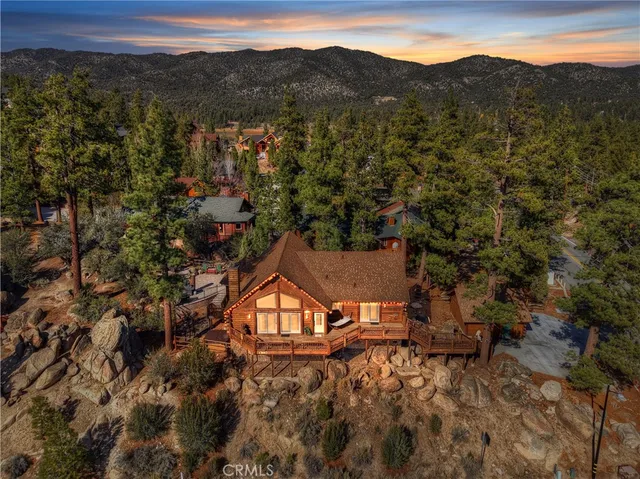 an aerial view of a house with mountain view