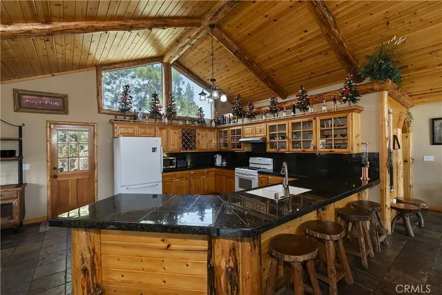 a view of a balcony with chairs and wooden floor