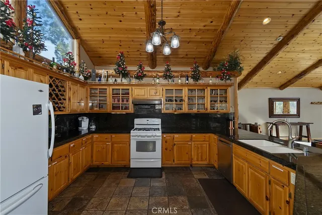 a kitchen with stainless steel appliances a sink and a stove