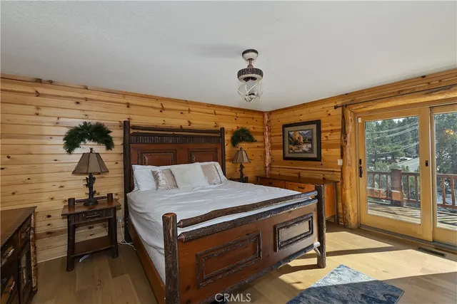 a bed room with a bed and a television