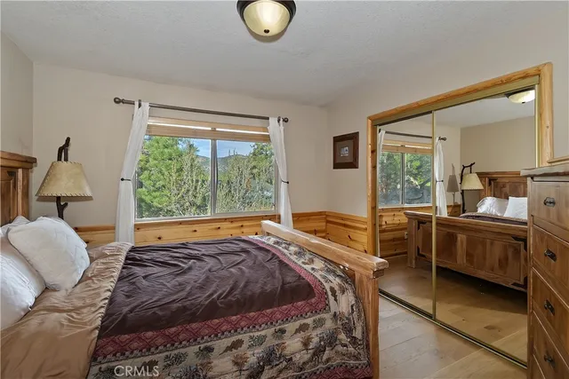 a bed room with a bed and a window