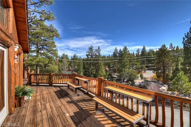 a view of a balcony with wooden floor and outdoor space