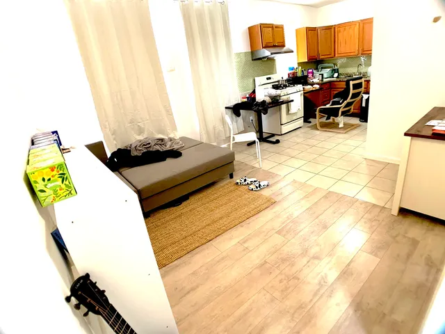 a bedroom with a bed and a desk