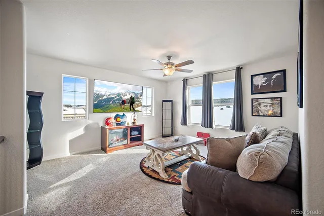 a bedroom with a bed and wall painting on the wall
