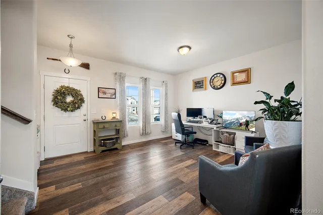 a living room with furniture and a table