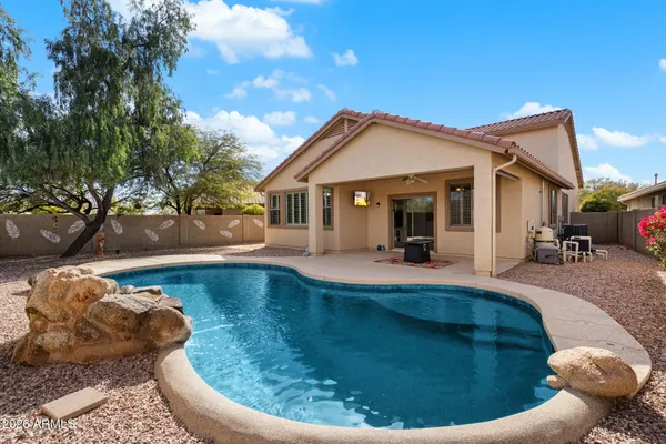 a view of a swimming pool with a patio