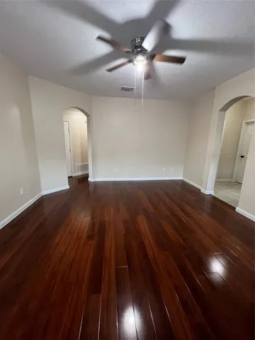 wooden floor in a hall with a window