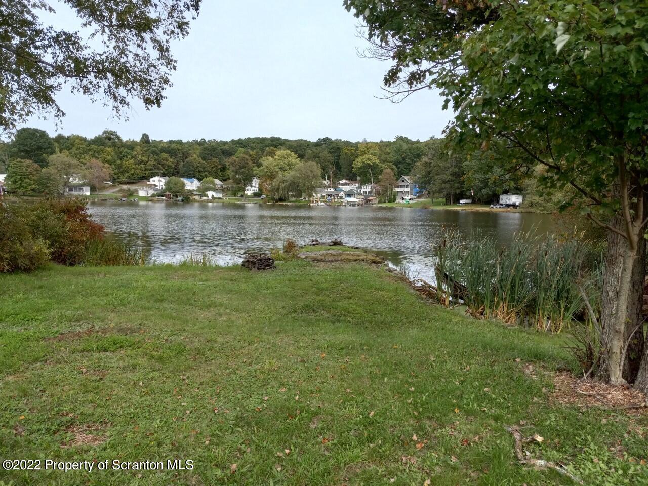 48 1/2 Indian Spring Road Tunkhannock, PA 18657 - Photo 13 of 15 a view of a lake in middle of forest
