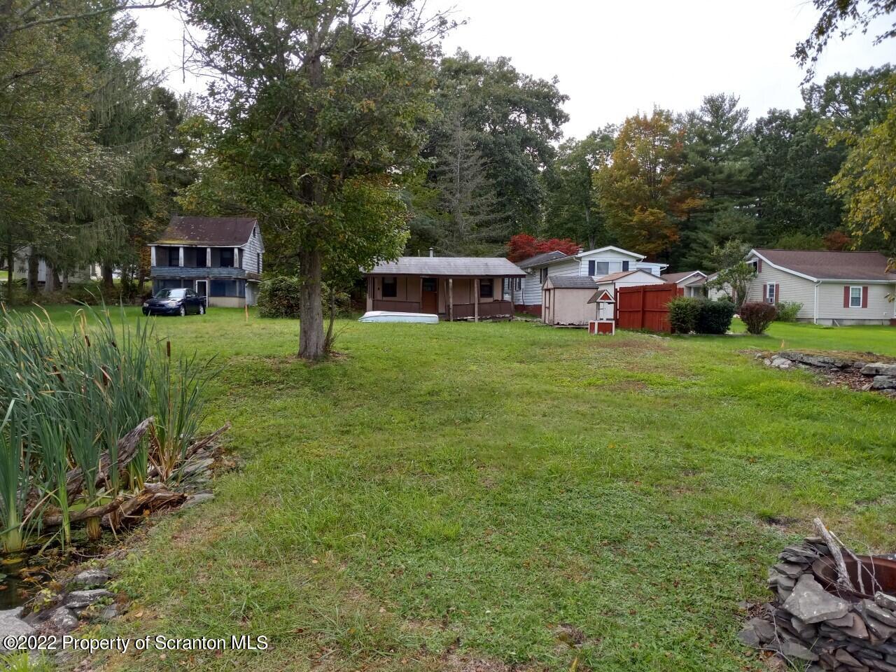 48 1/2 Indian Spring Road Tunkhannock, PA 18657 - Photo 3 of 15 a front view of a house with garden