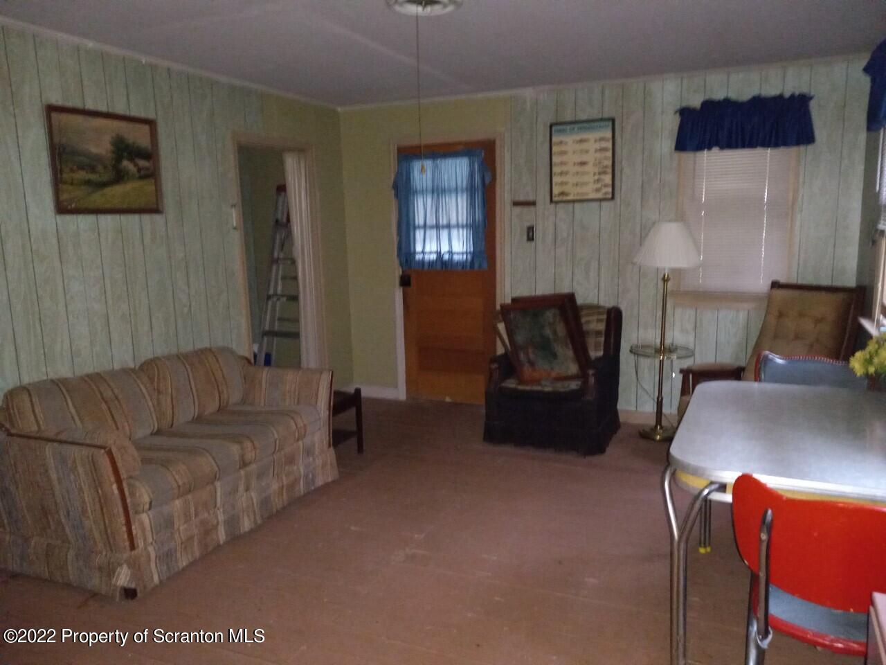 48 1/2 Indian Spring Road Tunkhannock, PA 18657 - Photo 7 of 15 a living room with furniture and a couch