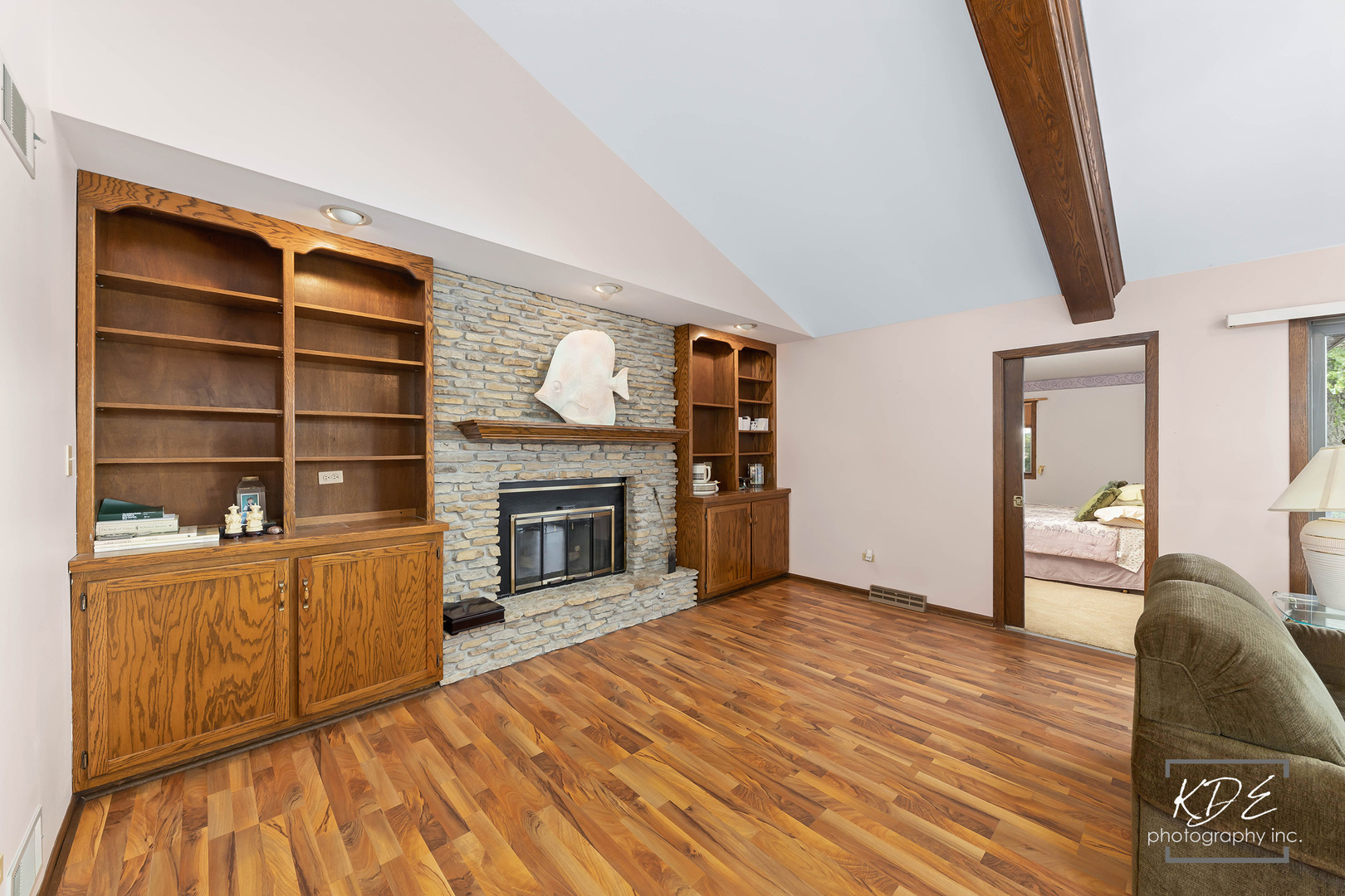 23211 Pilcher Road Plainfield, IL 60544 - Photo 15 of 58 a view of a livingroom with wooden floor and a fireplace