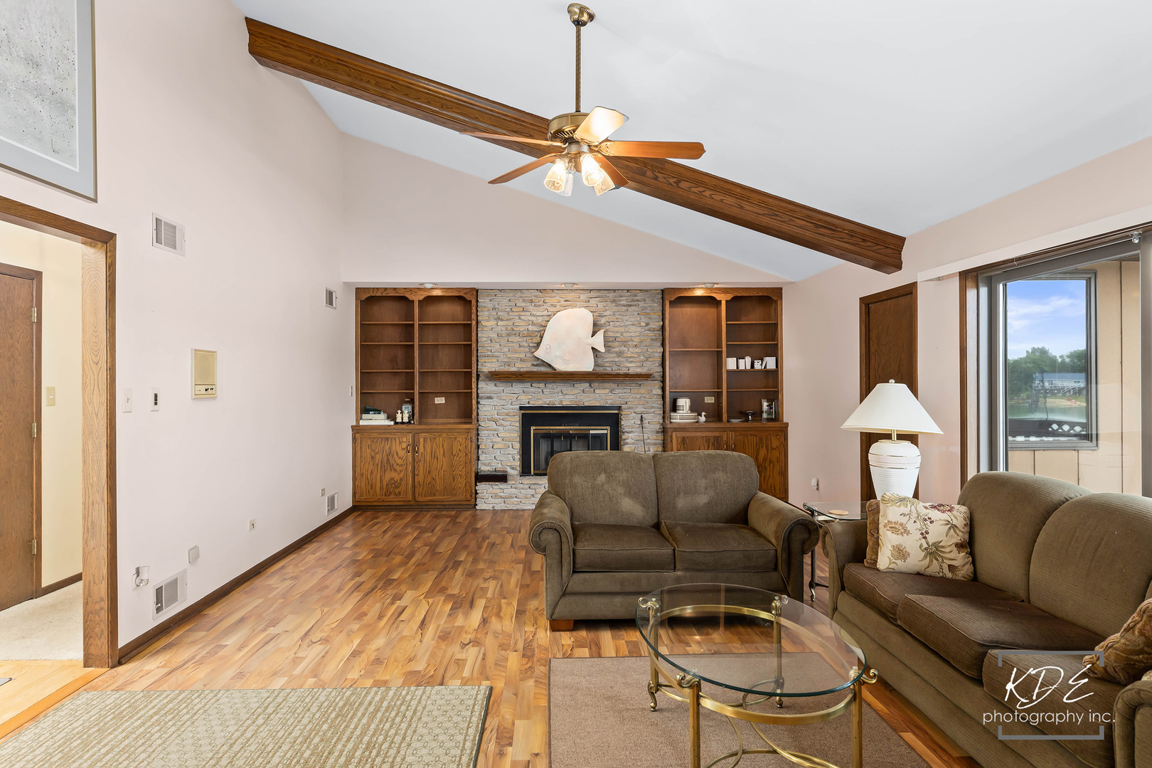 23211 Pilcher Road Plainfield, IL 60544 - Photo 16 of 58 a living room with furniture and a fireplace
