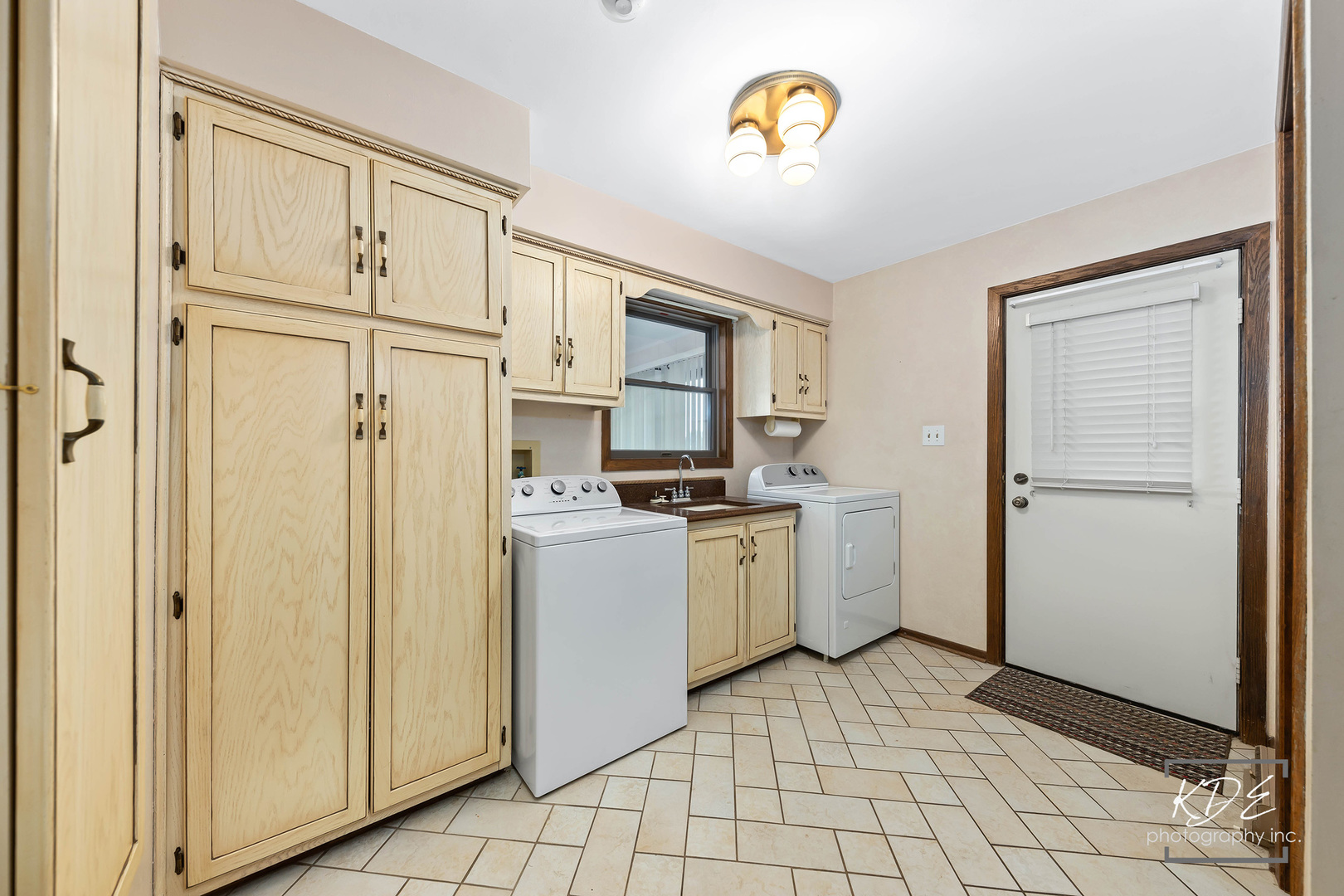 23211 Pilcher Road Plainfield, IL 60544 - Photo 25 of 58 a kitchen with a refrigerator a stove top oven and a sink