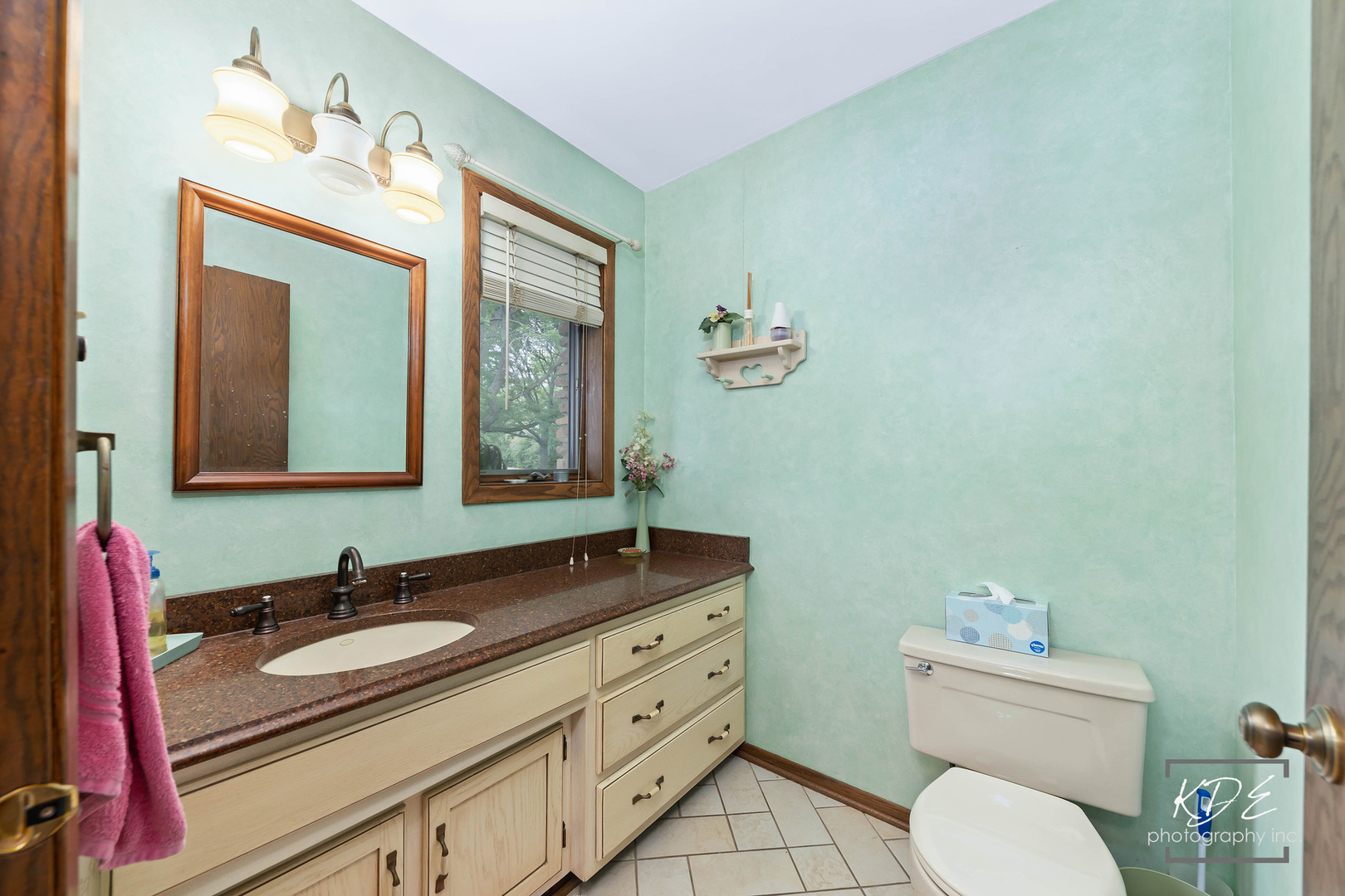 23211 Pilcher Road Plainfield, IL 60544 - Photo 26 of 58 a bathroom with a granite countertop sink mirror and toilet