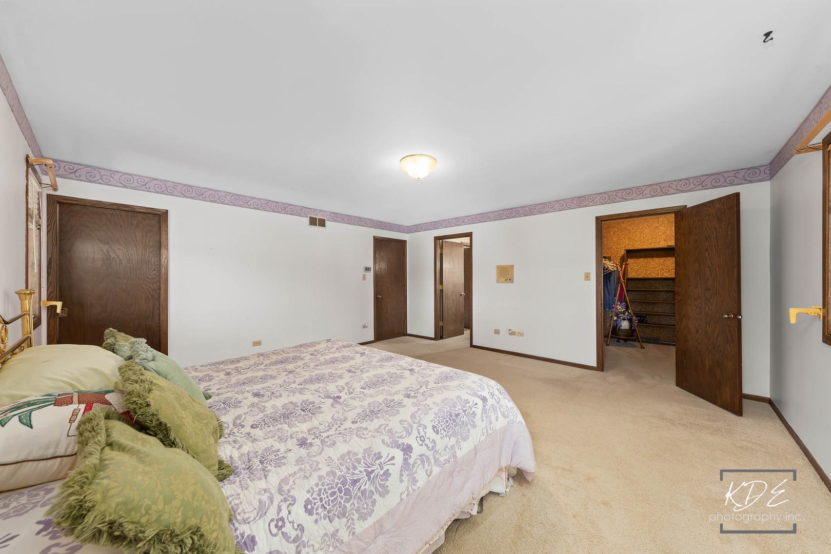 23211 Pilcher Road Plainfield, IL 60544 - Photo 29 of 58 a spacious bedroom with a bed and a walk in closet