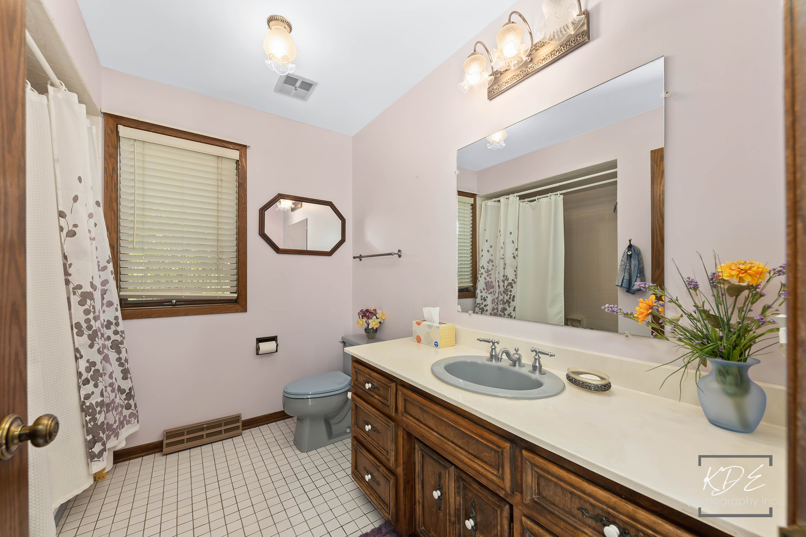 23211 Pilcher Road Plainfield, IL 60544 - Photo 35 of 58 a bathroom with a sink a toilet a mirror and shower