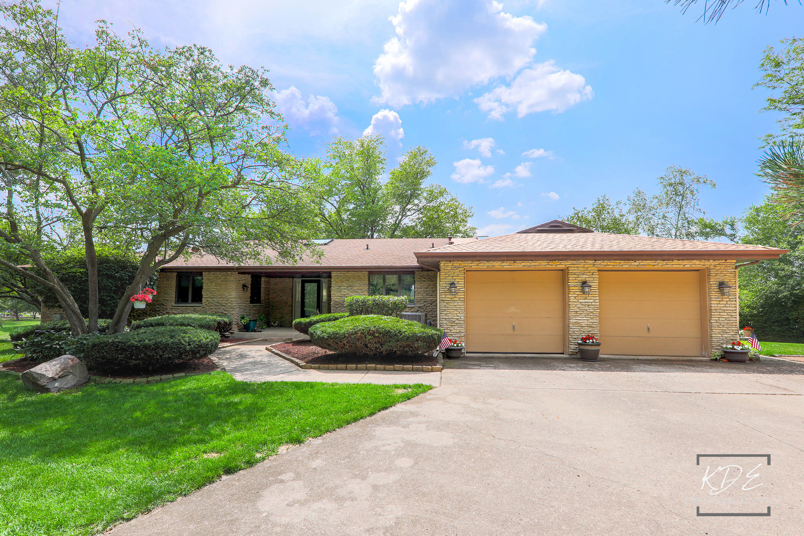 23211 Pilcher Road Plainfield, IL 60544 - Photo 7 of 58 a front view of a house with a yard and garage