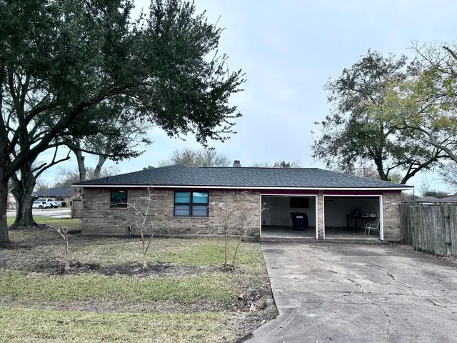 front view of a house with a tree