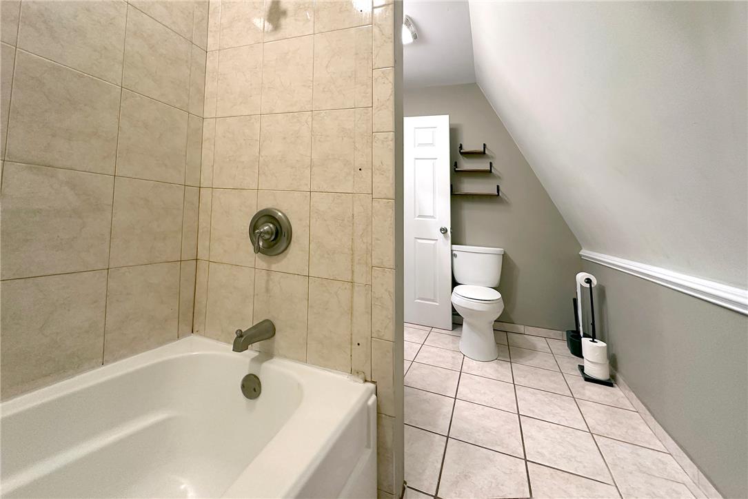 280 Oak Road Bangor, PA 18013 - Photo 22 of 52 Tiled flooring and a vaulted ceiling maximize the space in this functional bathroom layout.
