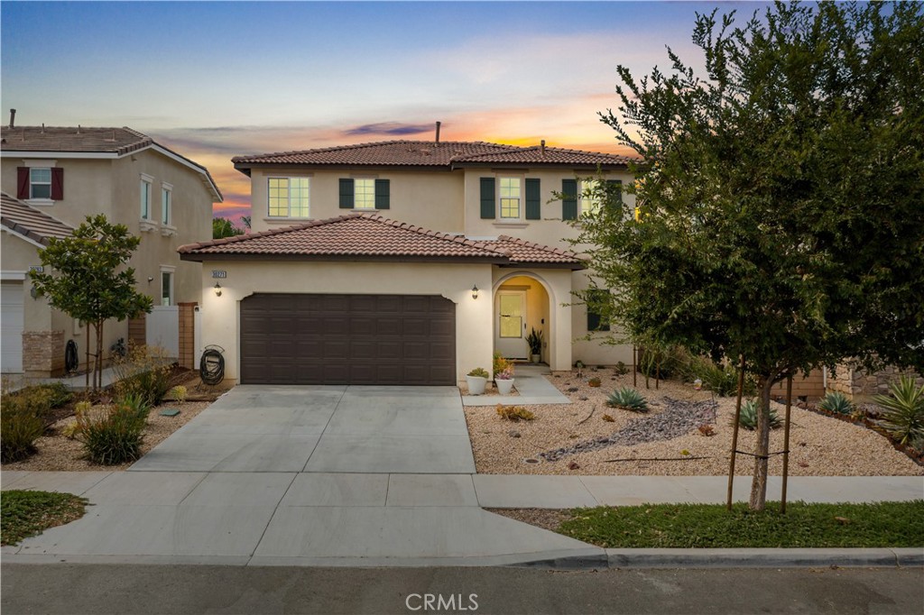 a front view of a house with garage