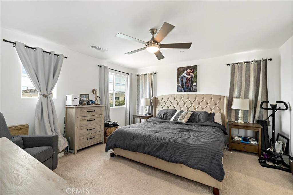 30271 Ramsay Drive Menifee, CA 92584 - Photo 15 of 34 a bedroom with a bed and a window