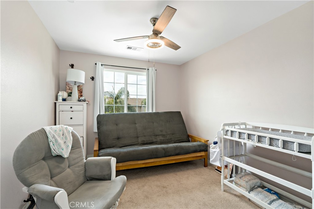 30271 Ramsay Drive Menifee, CA 92584 - Photo 23 of 34 a living room with furniture and a large window