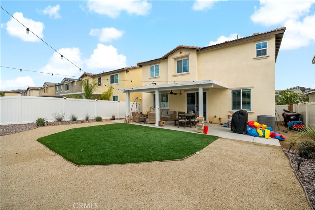 30271 Ramsay Drive Menifee, CA 92584 - Photo 27 of 34 a view of a house with a back yard