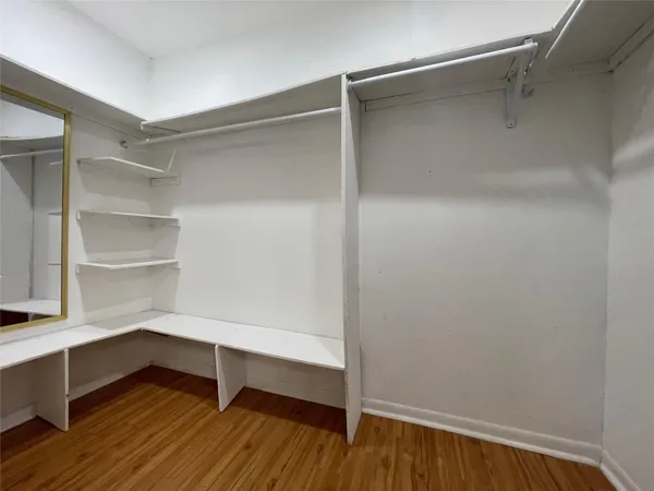 a view of an empty walk in closet