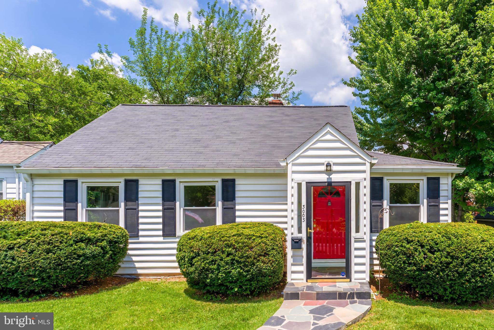 3003 Findley Road Kensington, MD 20895 - Photo 1 of 21 a front view of a house with yard