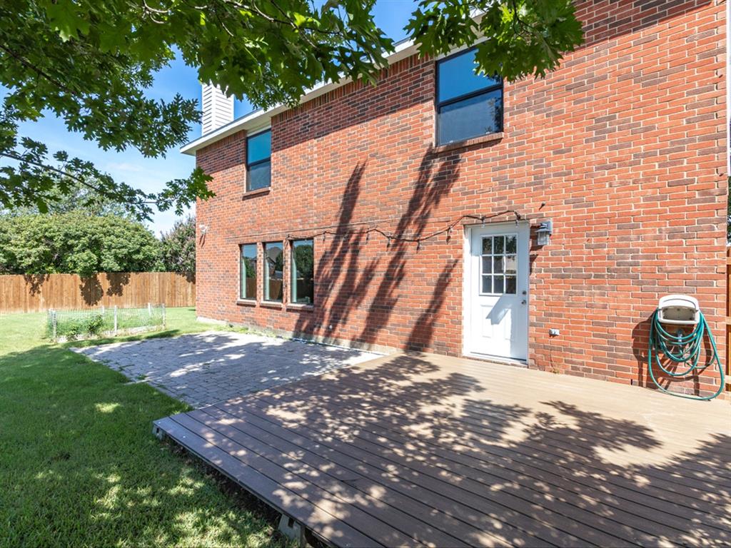 5304 Los Altos Road Fort Worth, TX 76244 - Photo 30 of 30 Rear view of house with brick siding and a chimney