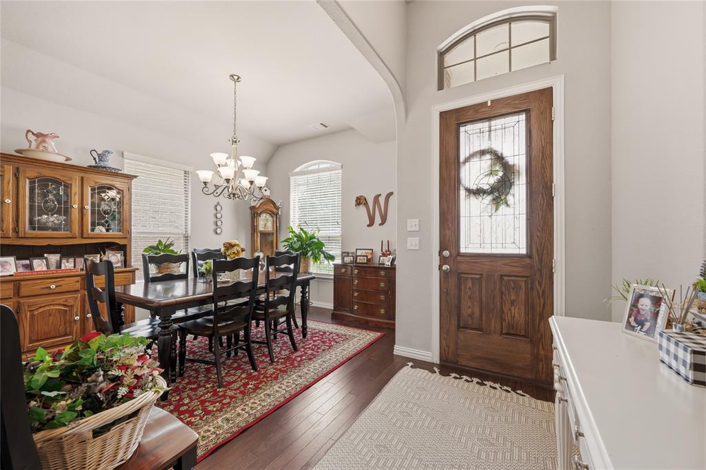 140 Chestnut Road Waxahachie, TX 75165 - Photo 5 of 26 Entryway featuring a wood-panel door with leaded glass insert and an arched transom window