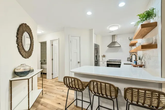 a kitchen with a table and chairs