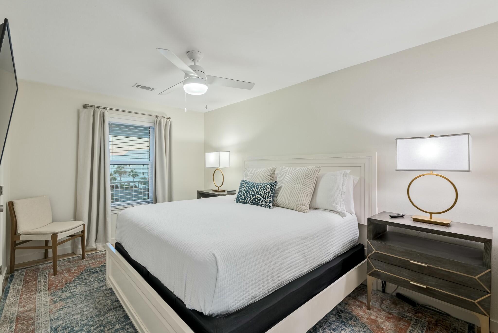 11 Beachside Drive, Unit 632 Santa Rosa Beach, FL 32459 - Photo 15 of 40 a bedroom with a bed and a chandelier