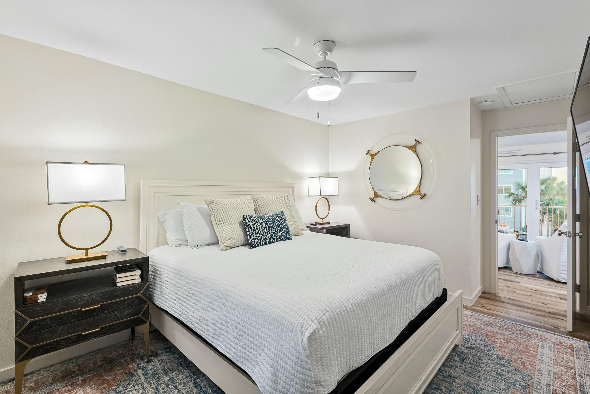 11 Beachside Drive, Unit 632 Santa Rosa Beach, FL 32459 - Photo 16 of 40 a bedroom with a bed and a chandelier