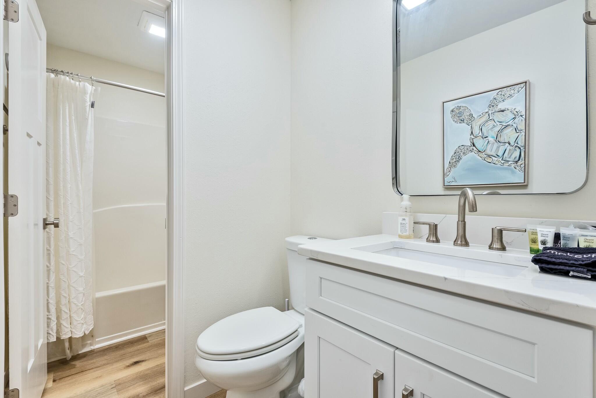 11 Beachside Drive, Unit 632 Santa Rosa Beach, FL 32459 - Photo 22 of 40 a bathroom with a toilet sink and mirror
