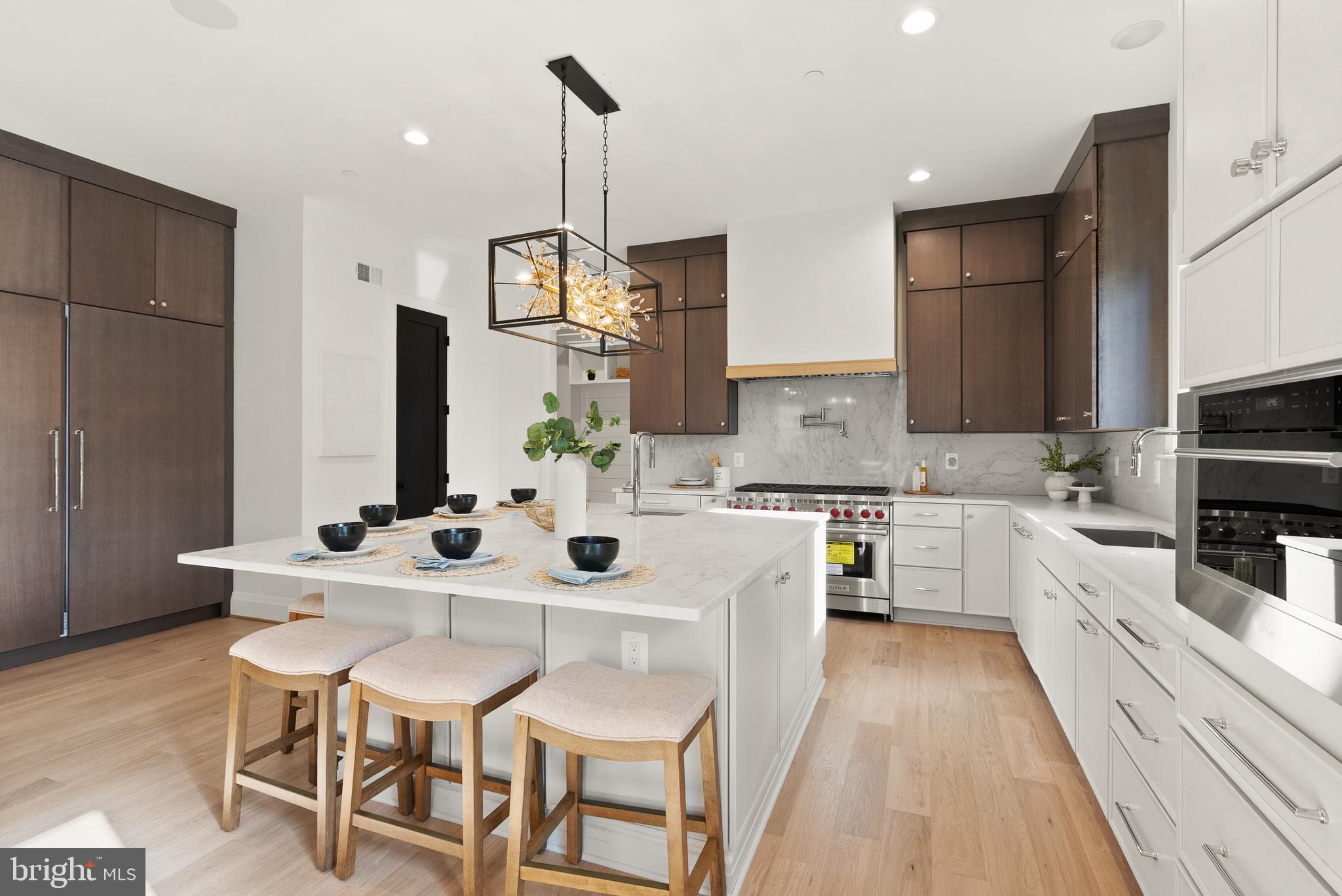5804 Ridgefield Road Bethesda, MD 20816 - Photo 14 of 53 a kitchen with stainless steel appliances kitchen island granite countertop a sink and cabinets