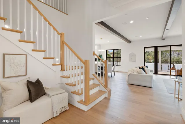 a living room with furniture fireplace and flat screen tv