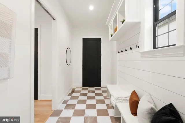 a view of a walk in closet with empty racks