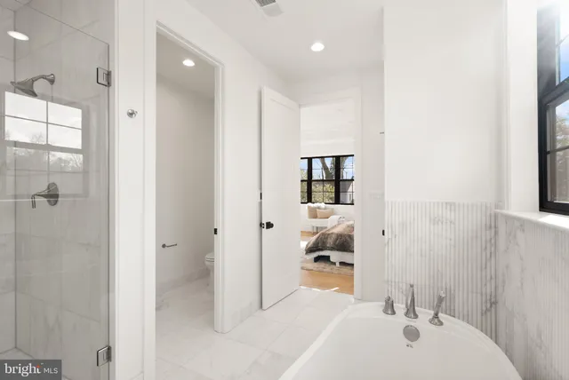 a view of bathroom with mirror