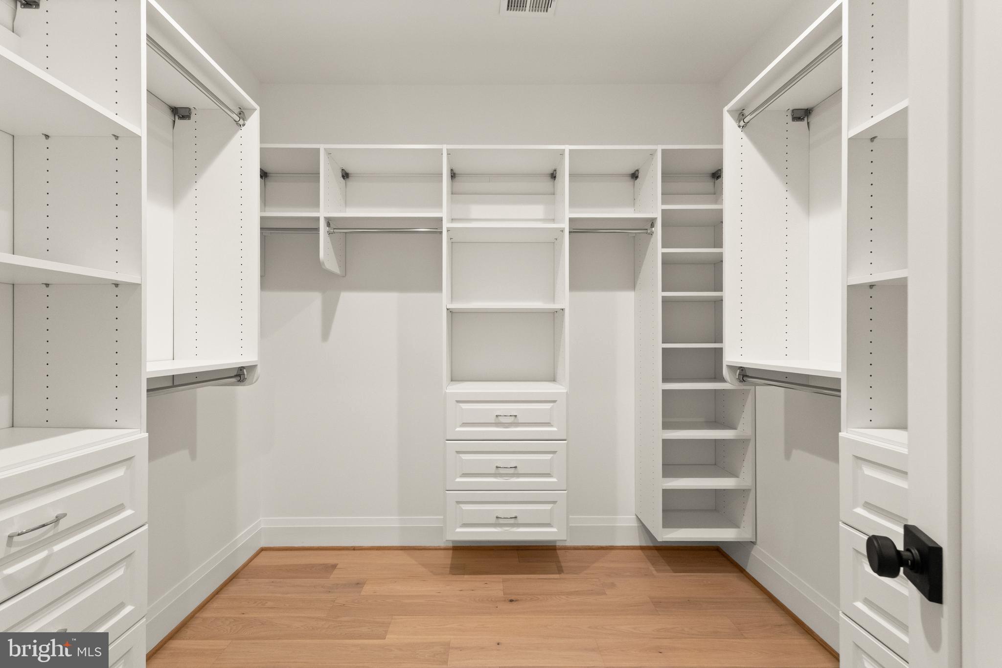 5804 Ridgefield Road Bethesda, MD 20816 - Photo 38 of 53 a view of walk in closet with empty racks