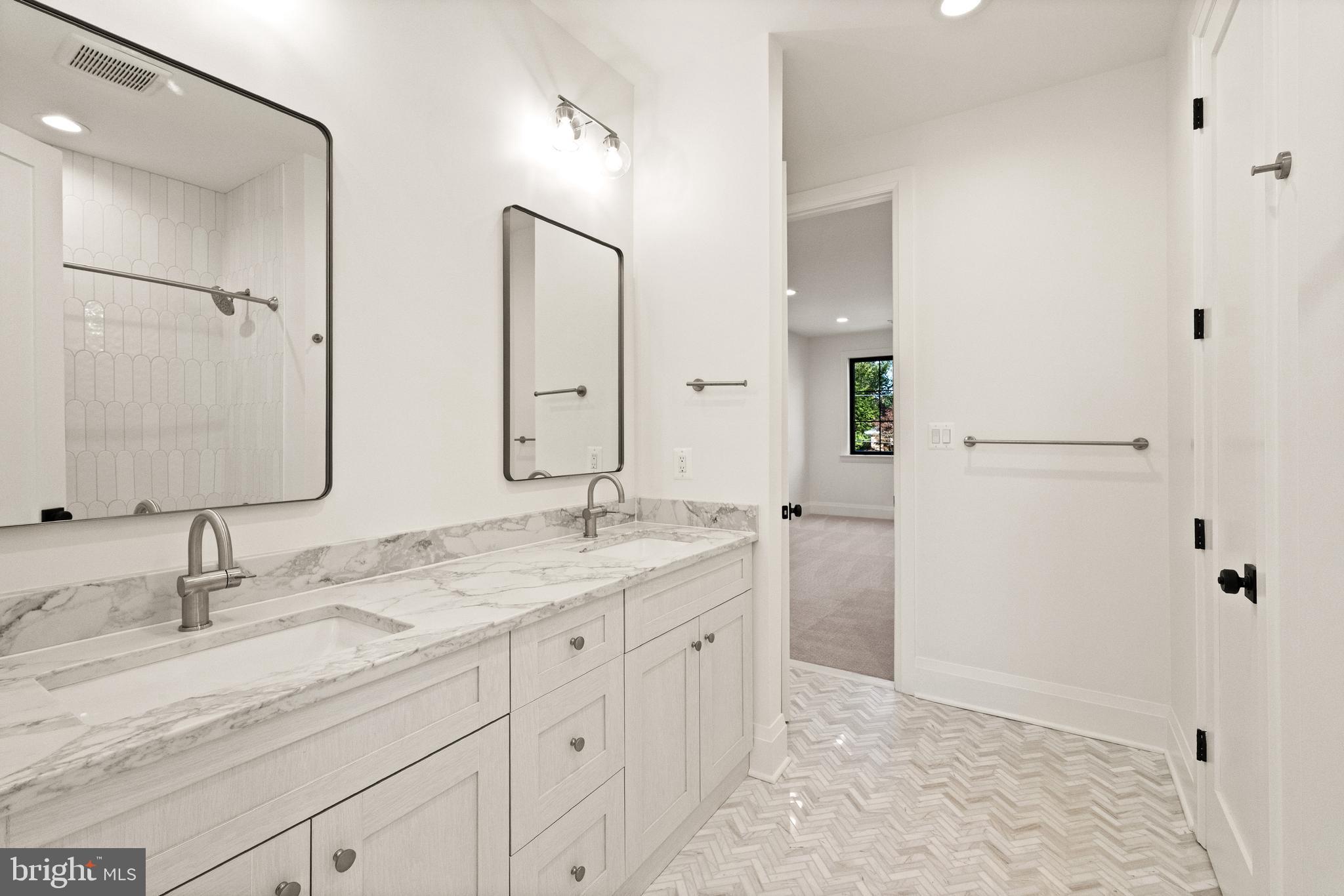 5804 Ridgefield Road Bethesda, MD 20816 - Photo 45 of 56 a bathroom with a granite countertop sink mirror and double
