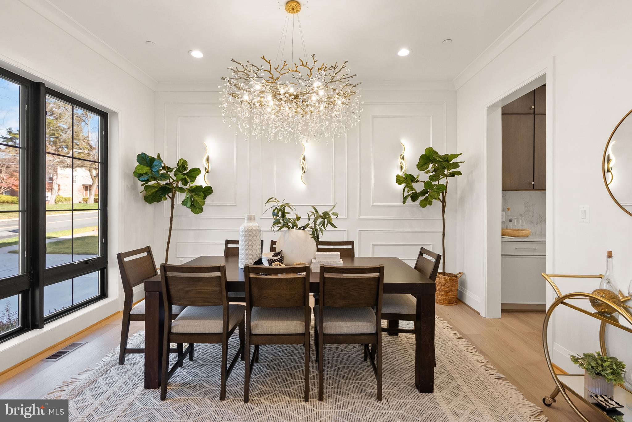 5804 Ridgefield Road Bethesda, MD 20816 - Photo 7 of 53 a view of a dining room with furniture and a potted plant