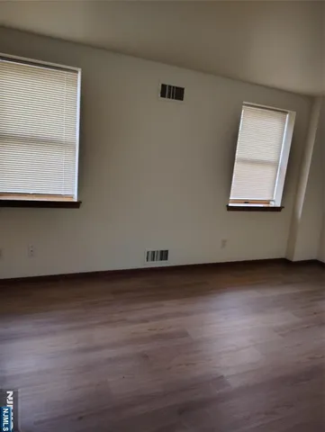 a view of a hardwood floor in a room