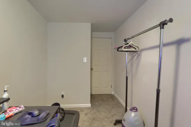 a bathroom with a sink a mirror and toilet