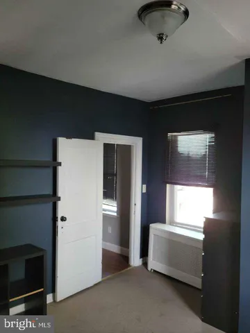 a bathroom with a tub and a window