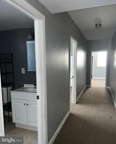 a living room with hard wood floors and a window