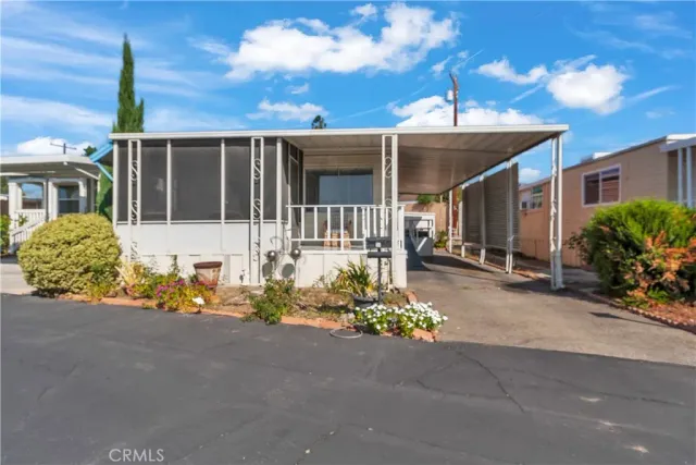a view of a dining room with furniture and window